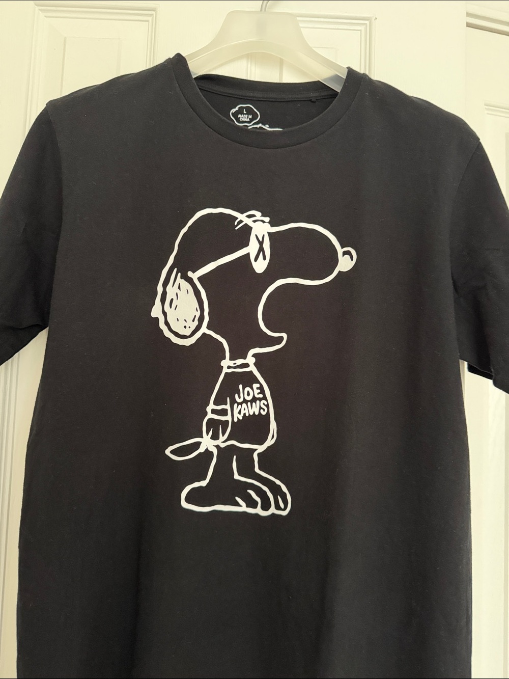 Uniqlo/Kaws-Peanut Snoopy Tshirt. Black. Mens size large